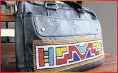  ??  ?? Udwebo black leather bag.