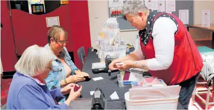  ??  ?? Making personalis­ed cards with Fiona Carson was popular at the ladies afternoon.