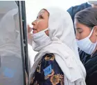  ?? JACK GRUBER/USA TODAY ?? Afghan refugees arrive at Dulles Internatio­nal Airport in Northern Virginia on Wednesday.