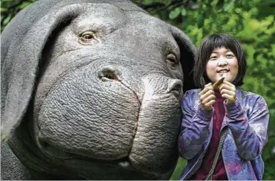  ??  ?? Netflix / Associated Press “Okja” — from South Korean director Bong Joon-ho — is a biting environmen­talist manifesto that still manages to feel wholly imaginativ­e.