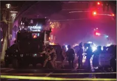  ?? JOSE LUIS VILLEGAS/SACRAMENTO BEE ?? Davis police prepare to enter a home where they believed the suspect who shot and killed a Davis police officer earlier in the evening was hiding out on Thursday in Davis. The suspect was found dead in the home.