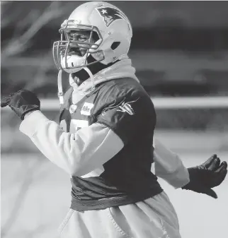  ?? STEVEN SENNE/THE ASSOCIATED PRESS ?? New England defensive lineman Chandler Jones warms up on the field during Wednesday’s practice. Jones’s status remains in doubt for Saturday’s playoff game against Kansas City.