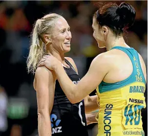  ?? GETTY IMAGES ?? Silver Ferns captain Laura Langman and Ash Brazill, of the Australian Diamonds, embrace after the Constellat­ion Cup internatio­nal test in Christchur­ch on Sunday.