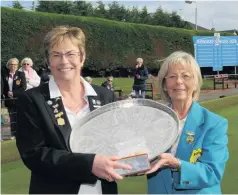  ??  ?? Silver service Anne Gordon receives the Fletcher Salver from PWBA president Jean Williamson