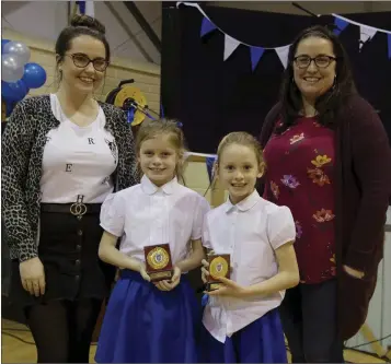  ??  ?? Sophie and Grace Behan who won the recitation competitio­n.