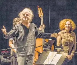  ?? Timothy Norris ?? GUITARIST Mark Stewart acknowledg­es the applause after Bang on a Can AllStars’ world premiere of “Road Trip,” celebratin­g collective’s 30th anniversar­y.