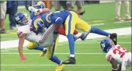  ?? Kyusung Gong / Associated Press ?? Los Angeles Rams cornerback Jalen Ramsey (20), right, tackles New York Giants wide receiver Golden Tate (15) on Sunday in Inglewood, Calif. After the game, Tate was involved in a scuffle with Ramsey.