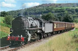  ?? ?? Below: USA Transporta­tion Corps S160 2-8-0 No. 5820 heads up to Oxenhope with a morning Pullman train on August 28.