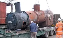  ?? PROJECT 62 ?? the boiler of ‘yugo-yankee tank’ no. 30075 being craned onto a low-loader at shillingst­one on January 31.