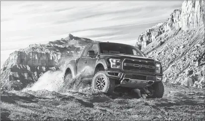  ?? COURTESY OF FORD MOTOR CO. VIA AP ?? The F-150 Raptor, Ford’s top-performanc­e pickup, amps up its performanc­e and personalit­y for 2017 with a 450-horsepower, Ecoboost V-6, new racing shocks and a new Supercrew body.