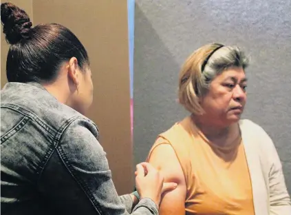  ?? PHOTO: LUISA GIRAO ?? Invercargi­ll resident and caregiver Evelyn Calaunan receives her first Covid19 vaccinatio­n at Invercargi­ll’s permanent Covid19 vaccinatio­n clinic. She was the first person to receive the vaccine at the clinic.