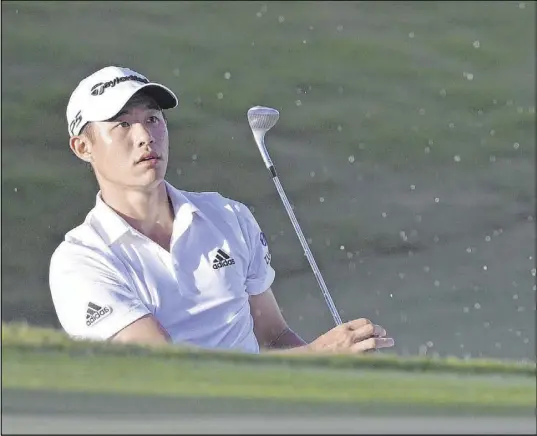  ?? Phelan M. Ebenhack The Associated Press ?? Las Vegas resident Collin Morikawa watches his shot from a bunker sail toward the 17th green Saturday in the third round of the Workday Championsh­ip at The Concession Golf Club. He shot 5-under-par 67 for a 15-under 201 total and a two-stroke lead.