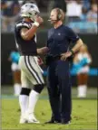  ?? JASON E. MICZEK — THE ASSOCIATED PRESS ?? Dallas Cowboys quarterbac­k Dak Prescott, left, talks with head coach Jason Garrett during the second half of Sunday’s game against the Carolina Panthers.
