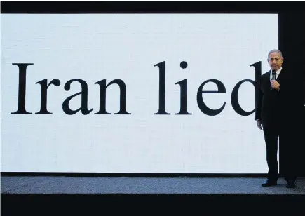  ?? — THE ASSOCIATED PRESS ?? Israeli Prime Minister Benjamin Netanyahu says his government has obtained ‘half a ton’ of secret Iranian documents showing that Iran lied about its nuclear ambitions before signing a 2015 deal with world powers. President Donald Trump is threatenin­g...