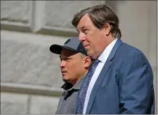  ?? STUART CAHILL — BOSTON HERALD ?? Accused rapist Ivan Cheung outside Suffolk Superior Court with his lawyer Peter Parker following a hearing on April 11.