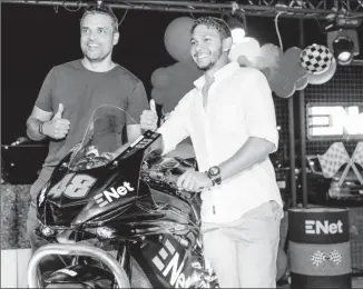 ?? ?? Biker Matthew Vieira (right) and CEO of ENet Vishok Persaud pose with the branded Yamaha R6.