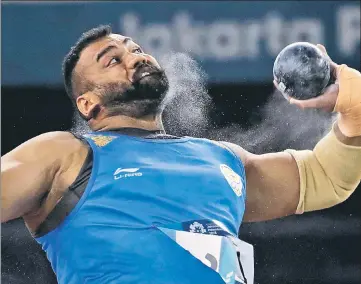  ?? AP ?? Tajinderpa­l Singh Toor in action during the men's shot put final on the opening day of the athletics competitio­n.