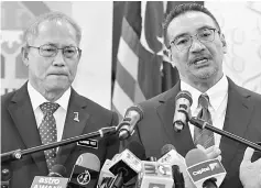  ??  ?? Hishammudd­in with Human Resource Minister Datuk Seri Richard Riot (left) during the press conference after signing of a MoU on Recognitio­n of Prior Achievemen­t programme at Wisma Perwira ATM in Kuala Lumpur. — Bernama photo