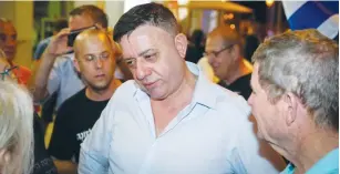  ?? (Flash90) ?? NEWLY ELECTED Labor Party leader Avi Gabbay takes part in a weekly protest outside the Petah Tikva home of Attorney-General Avichai Mandelblit on Saturday night.