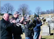  ?? ?? Members of the Boyertown Alumni Band play “Taps” at the Boyertown Area Historical Society’s memorial service at Fairview Cemetery on Jan. 15.