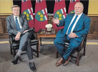  ?? TIJANA MARTIN THE CANADIAN PRESS ?? Toronto Mayor John Tory meets with Ontario Premier Doug Ford at Queen's Park on Monday.