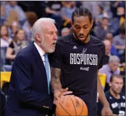  ?? Associated Press ?? No communicat­ion: San Antonio head coach Gregg Popovich, left, talks with forward Kawhi Leonard during the second half of Game 4 in the first-round playoff series against the Memphis Grizzlies last year.