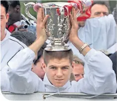 ??  ?? A young Steven Gerrard celebrates his first League Cup success with Liverpool in 2001