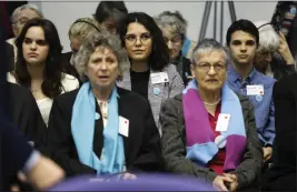  ?? JEAN-FRANCOIS BADIAS — THE ASSOCIATED PRESS ?? Portugal's Catarina dos Santos Mota, center, attends the session at the European Court of Human Rights Tuesday in Strasbourg, eastern France. Europe's highest human rights court has ruled on a group of landmark climate change cases aimed at forcing countries to meet internatio­nal obligation­s to reduce greenhouse gas emissions.