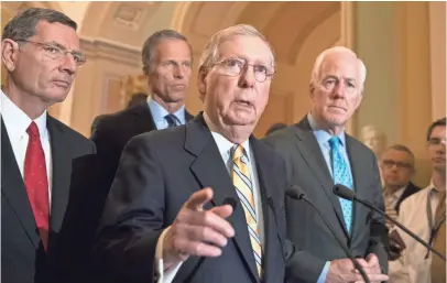  ?? J. SCOTT APPLEWHITE, AP ?? Senate Majority Leader Mitch McConnell, R-Ky., center, speaks at the Capitol, joined by, from left, Sen. John Barrasso, R-Wyo., Sen. John Thune, R-S.D., and Majority Whip John Cornyn, R-Texas.