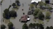  ?? DAVID J. PHILLIP — ASSOCIATED PRESS ?? Homes are surrounded by floodwater­s in the aftermath of Hurricane Harvey Friday, Sept. 1, 2017, near Beaumont, Texas.