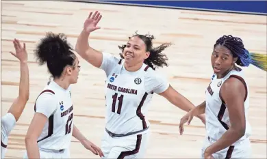  ?? Ap-eric Gay ?? South Carolina guard Destiny Littleton (11) celebrates a score against Georgia Tech during the first half of a college basketball game in the Sweet Sixteen round of the women’s NCAA tournament at the Alamodome in San Antonio on Sunday.