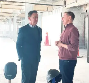  ?? Paul Schott / Hearst Connecticu­t Media ?? Gov. Ned Lamont, left, and Digital Currency Group founder and CEO Barry Silbert talk on Monday at the future DCG headquarte­rs at 290 Harbor Drive in Stamford.