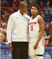  ?? DAVID JABLONSKI / STAFF ?? Dayton’s coach Anthony Grant talks to Malachi Smith during last Friday’s game against Saint Louis at UD Arena.