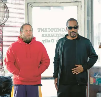  ?? NETFLIX ?? Jonah Hill, left, as Ezra, and Eddie Murphy as Akbar in the buddy rom-com “You People.”