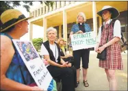  ??  ?? From left; Patricia Little, of Mansfield, Rev. Cynthia Willauer, of Lyme, Rev. Lucy LaRocca, of Madison, and Rev. Carol Rawls, of Redding, attend an immigratio­n rally.