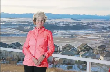  ?? Gavin Young/ Calgary Herald ?? Myrna Dube, CEO of the Parks Foundation Calgary, at her Gleneagles home in Cochrane. Her favourite part of the house is the view — especially from her deck and living areas, which overlook the Bow Valley and the town.