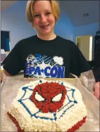  ?? Submitted photo ?? CONFECTION CREATION: Caitlin Covey displays a Spider-Man cake she created using one of the 26 cake pans the Garland County Library now offers patrons to check out. The library is encouragin­g patrons who use the cake pans to send in photos of their creations once completed.