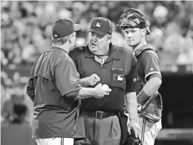  ?? TOM SZCZERBOWS­KI, GETTY IMAGES ?? Joe West has been an MLB umpire since 1976 and has worked the third-most games in history. “It’s something I’m not making a big deal out of, but it’s something I’m very proud of,” he says.