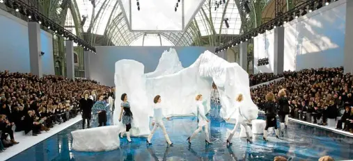  ?? —REUTERS ?? Nothing is too extravagan­t at Chanel. For Fall-Winter 2010-11 women’s ready-to-wear show, a 30-ft, 265-ton iceberg was transporte­d from Sweden to Paris’ Grand Palais. It took six days and 35 ice sculptors to bring Lagerfeld’s vision to life.