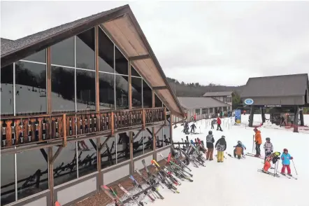  ?? ?? Skiers get set for a run at Snow Trails in Mansfield on Sunday. Since the start of the COVID-19 pandemic in March 2020, skiing has seen a boom in popularity as people look for safe, outdoor activities to undertake.