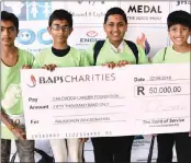  ??  ?? The BAPS Swaminaray­an Mandir in Mayfair hosted a Walkathon last Sunday. In the run-up to the event, the pupils of the Gujarati School, run by the organisati­on, raised R50 000 for the charity CHOC. With the cheque were, from left, Jai Nana, Sneh Patel, Dutt Patel and Rahul Desai.