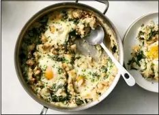  ?? DAVID MALOSH — THE NEW YORK TIMES ?? Colcannon inspires this buttery casserole of mashed potatoes, kale, cheddar and baked eggs.