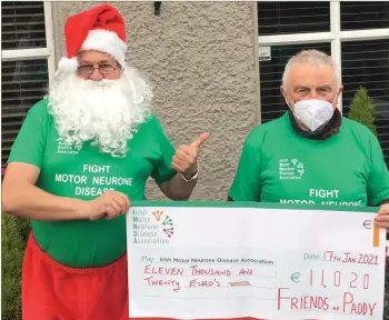  ??  ?? Paddy Byrne Snr with Santa receiving a cheque for an amazing amount of €11,020 just to get Santa back to Lapland.