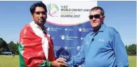  ??  ?? FIVE FOR: Oman’s Bilal Khan receives his man of the match award.