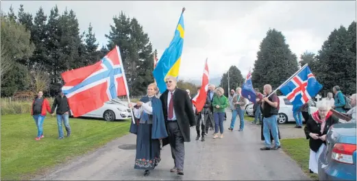  ??  ?? First Secretary of the Norwegian Embassy, Canberra, Beate Gabrielsen and Honorary Norwegian Consul in New Zealand Graeme Mitchell led the march from the Settlers’ Cemetery to the Commemorat­ive Oak in Norsewood on Sunday May 20.