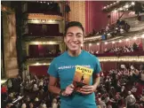  ?? — AP photos ?? Mauricio Gonzalez posing for a photo at THE CIBC Theatre in Chicago while attending the performanc­e “Hamilton: An American Musical” in downtown Chicago.