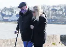  ??  ?? Posed pictures: Michael Stone and wife Karan walking by the sea