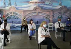  ?? AP PHOTO/
JAE C HONG ?? Medical workers wait in the holding area after getting the Pfizer-BioNTech COVID-19 vaccine at St. Joseph Hospital in Orange, Calif. Thursday.