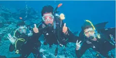  ??  ?? DIVING IN: Dario Castiglia checks out the Reef near Lizard Island.