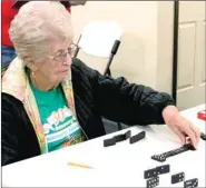  ??  ?? Mavis Barnes of Farmington competes in Dominoes at the Senior Games. Most of the events at the games were sporting
and action events but two games, Dominoes and SkipBo, required senior adults to use strategy and mental skills. Four senior adults from...